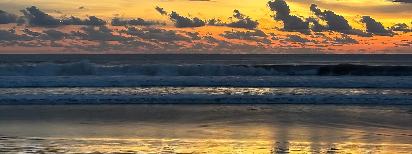Beautiful sunset at a local Mandurah, Western Australian Beach with small crashing waves